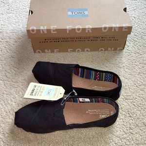 Brand new size 9 (womens) black Toms. Tags still on